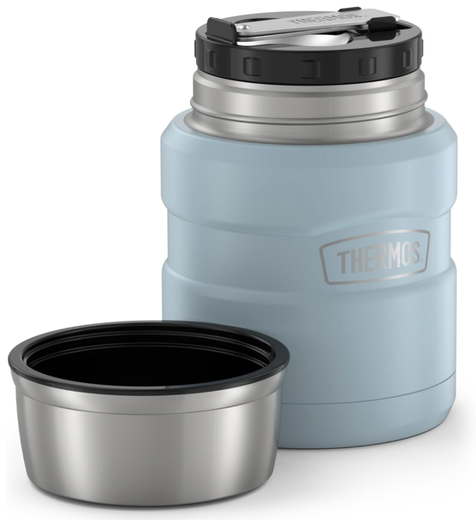 Thermos: Stainless steel thermos soup jar (16 oz) with spoon, steam rising from hot pasta on a kitchen island.